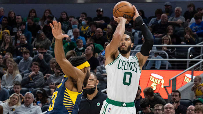 Boston Celtics forward Jayson Tatum (0) shoots the ball